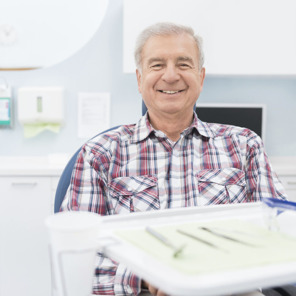 man smiling at dentist